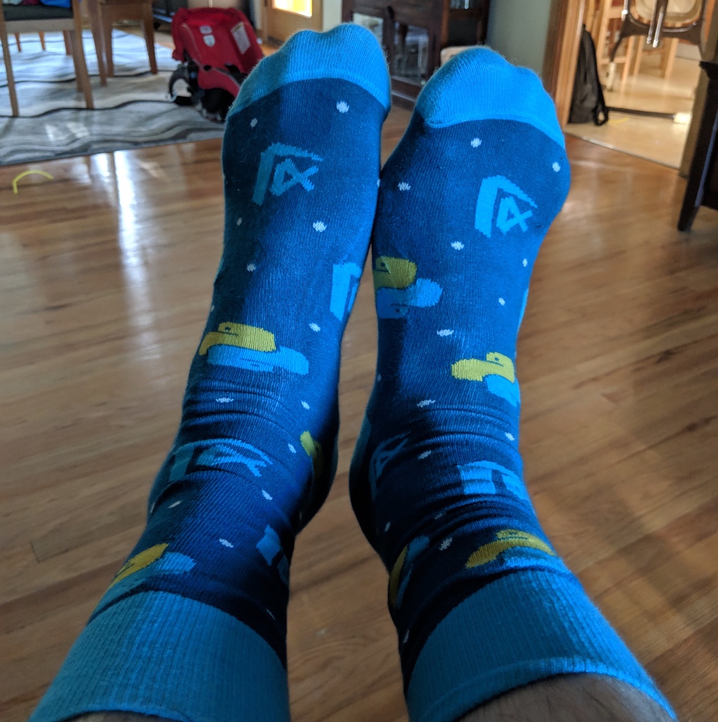 Ben's socks with Python and VS Code logos.